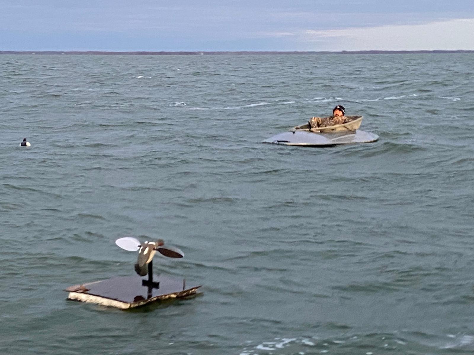 Layout boat and sea duck decoy spread during a guided Lake Huron duck hunt